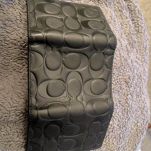 Tri fold Coach wallet. Never been used before.